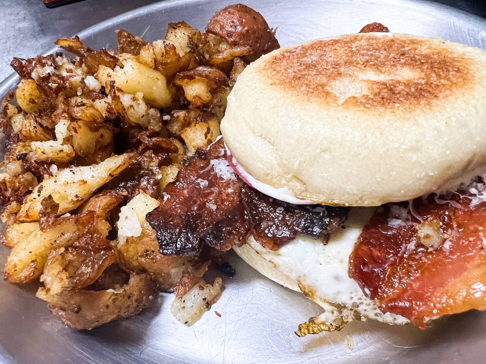 Breakfast Sandwich — Blue Oven English Muffin, sunny side egg, bacon, tarragon aioli, with a side of NSYC smashed potatoes