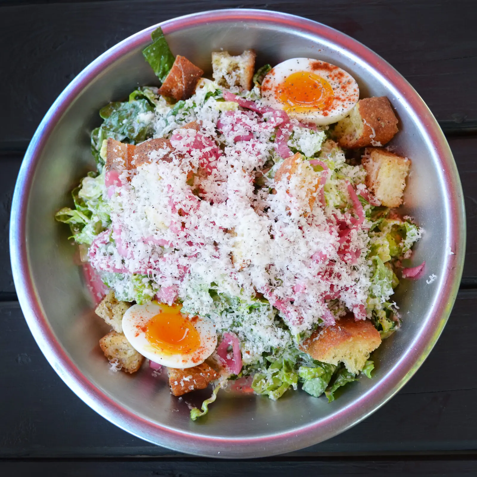 Tijuana Caesar Salad with soft-boiled egg, pickled red onion and shaved parmesan