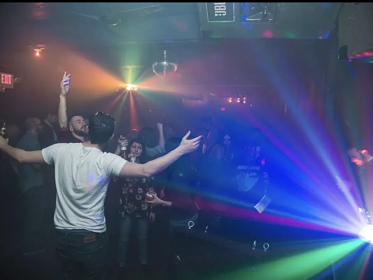 Packed dance floor under disco lights at Northside Yacht Club
