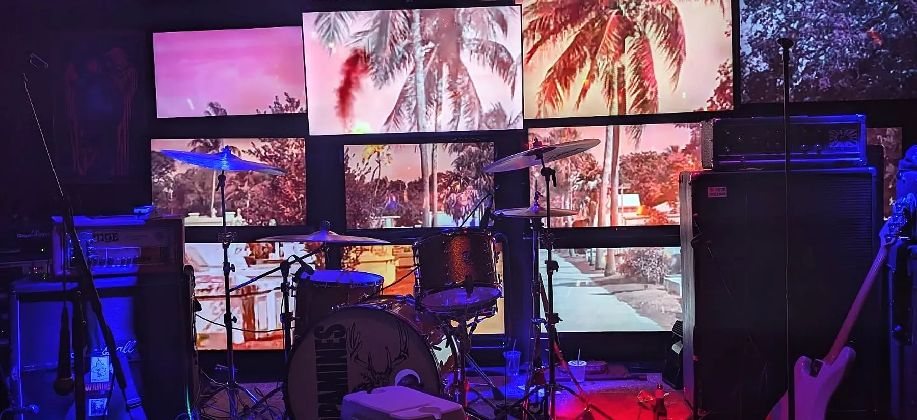The stage at Northside Yacht Club — drum kit and amps in front of the video wall