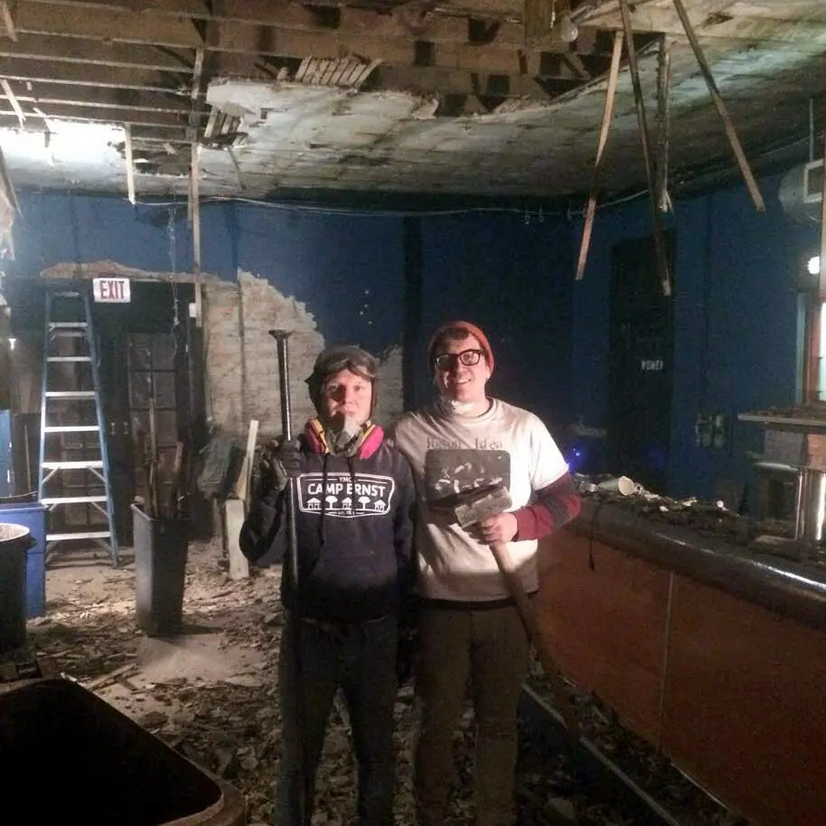 Jon and Stu, sledgehammers in hand, gutting the building that became NSYC