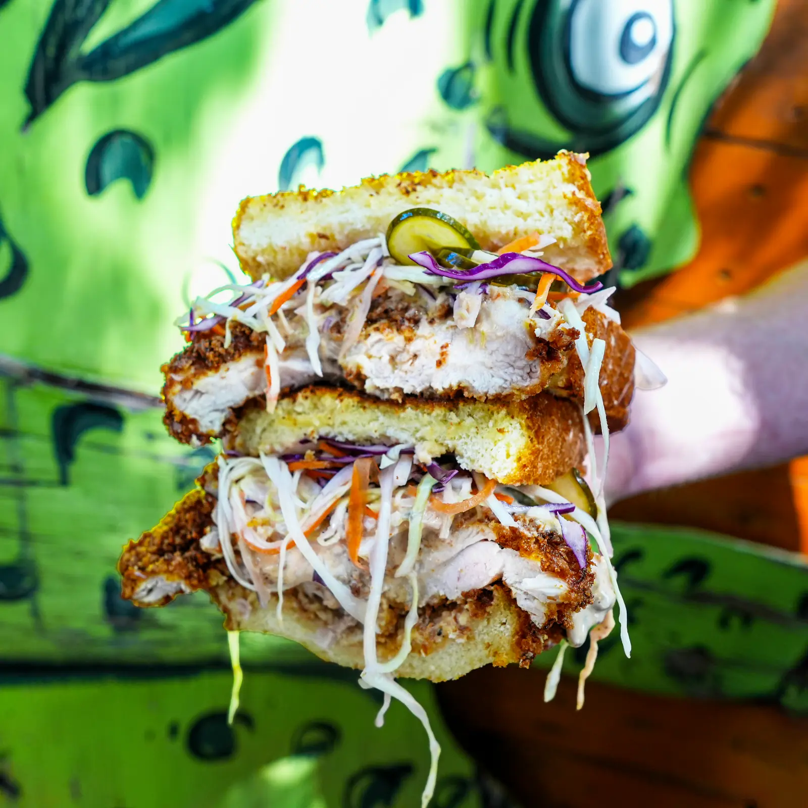 Katsu Sando cross-section — chicken cutlet, slaw and sweet pickles on house-baked milk bread