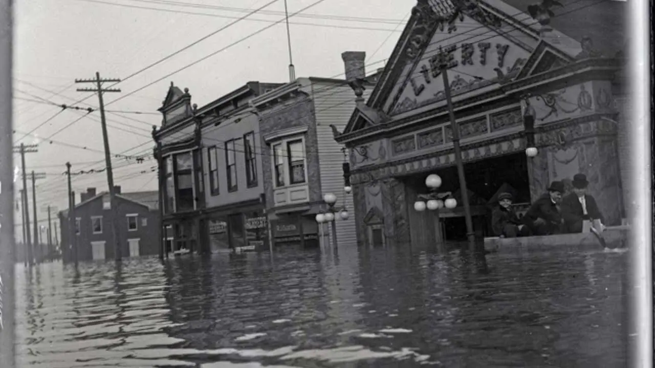 The Liberty Theater in Northside during the great flood — neighbors wading through the streets