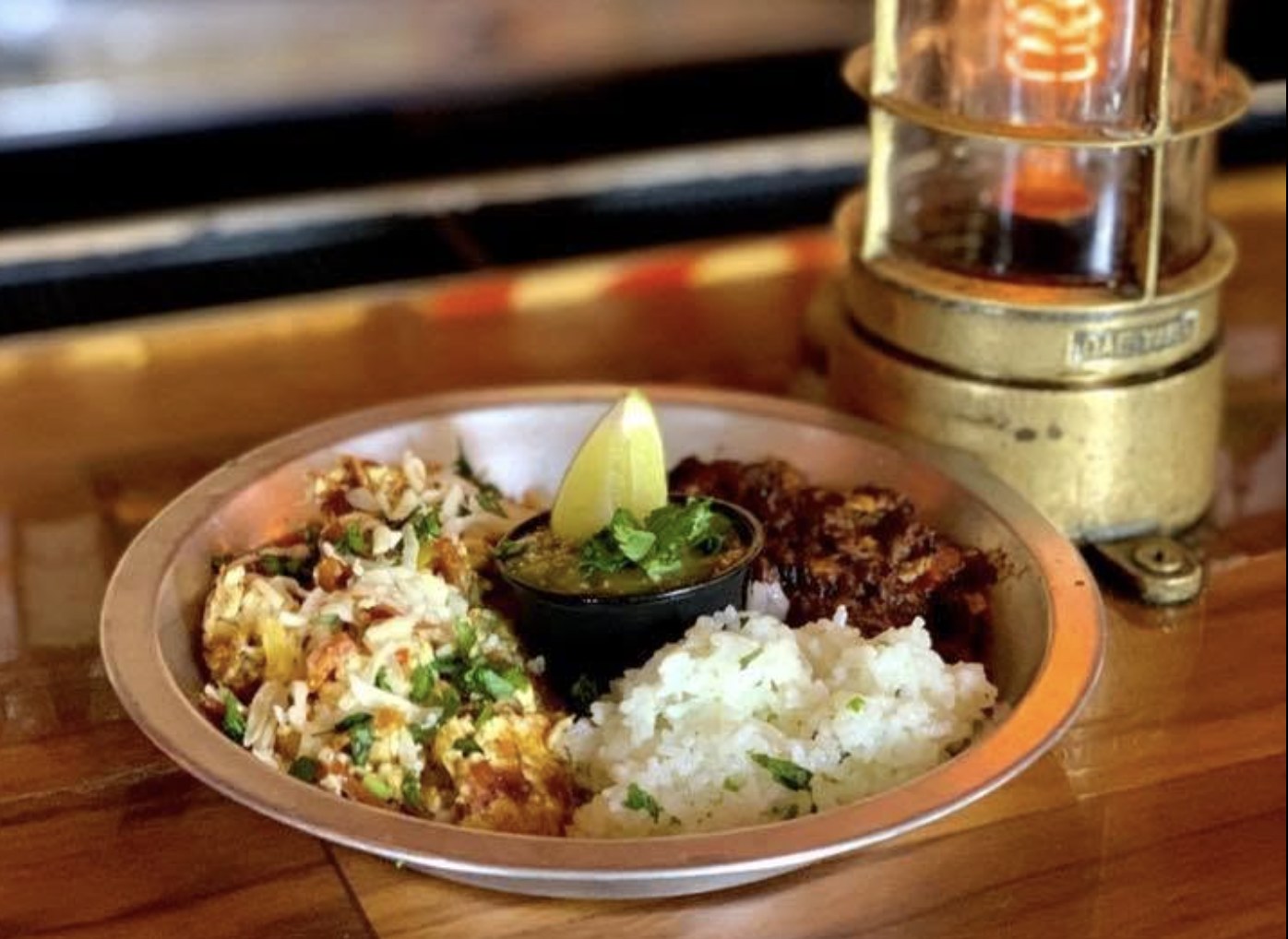 Jerri Queen's Migas — scrambled eggs with tortilla chips, cotija cheese, tomatillo salsa, rice and black beans