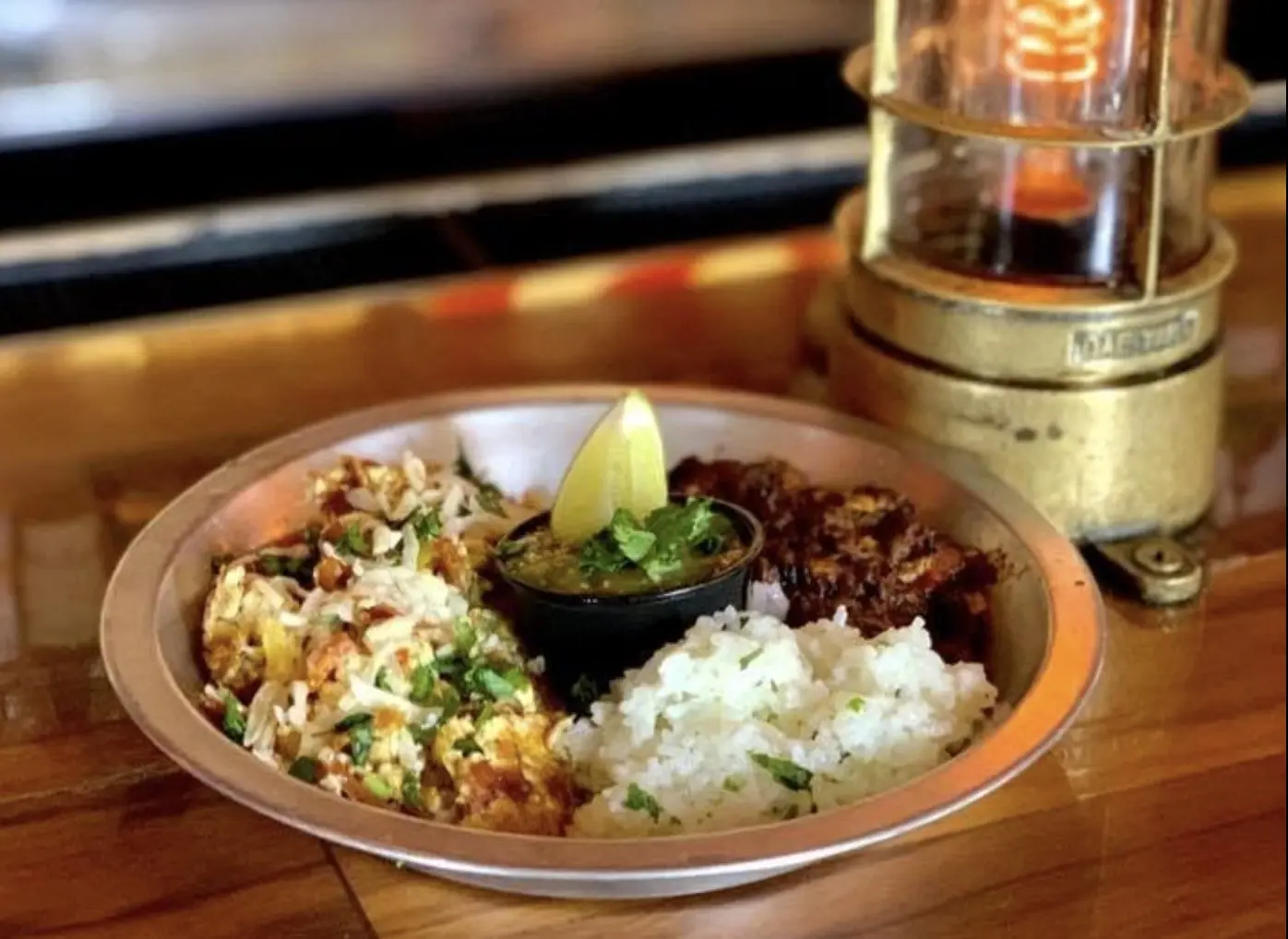 Jerri Queen's Migas — scrambled eggs with tortilla chips, cotija cheese, tomatillo salsa, rice and black beans