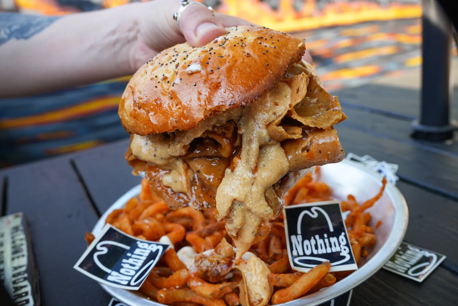 The Nihilist RB's melt — sliced roast beef and 3-cheese Mornay on a Nicky T onion roll, held over curly fries