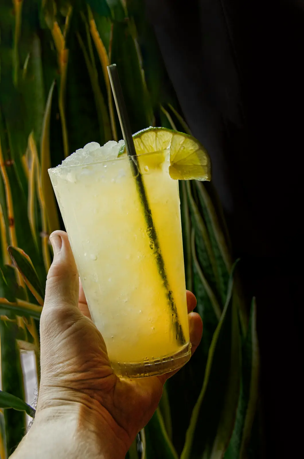 The Pineapple Creamy Marg over crushed ice with a lime wheel