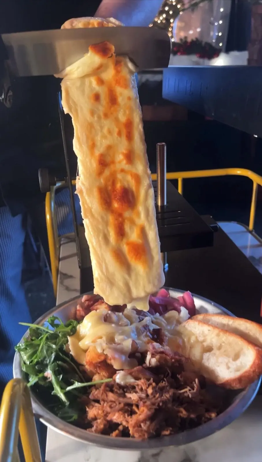 Raclette cheese pull over pulled pork